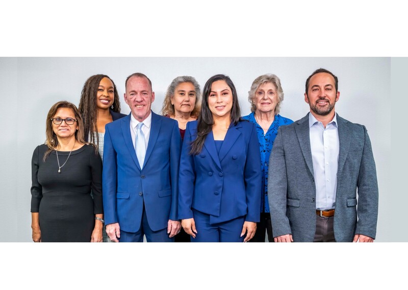 Photo of Board Directors standing in two rows, four in the front and three in the back.